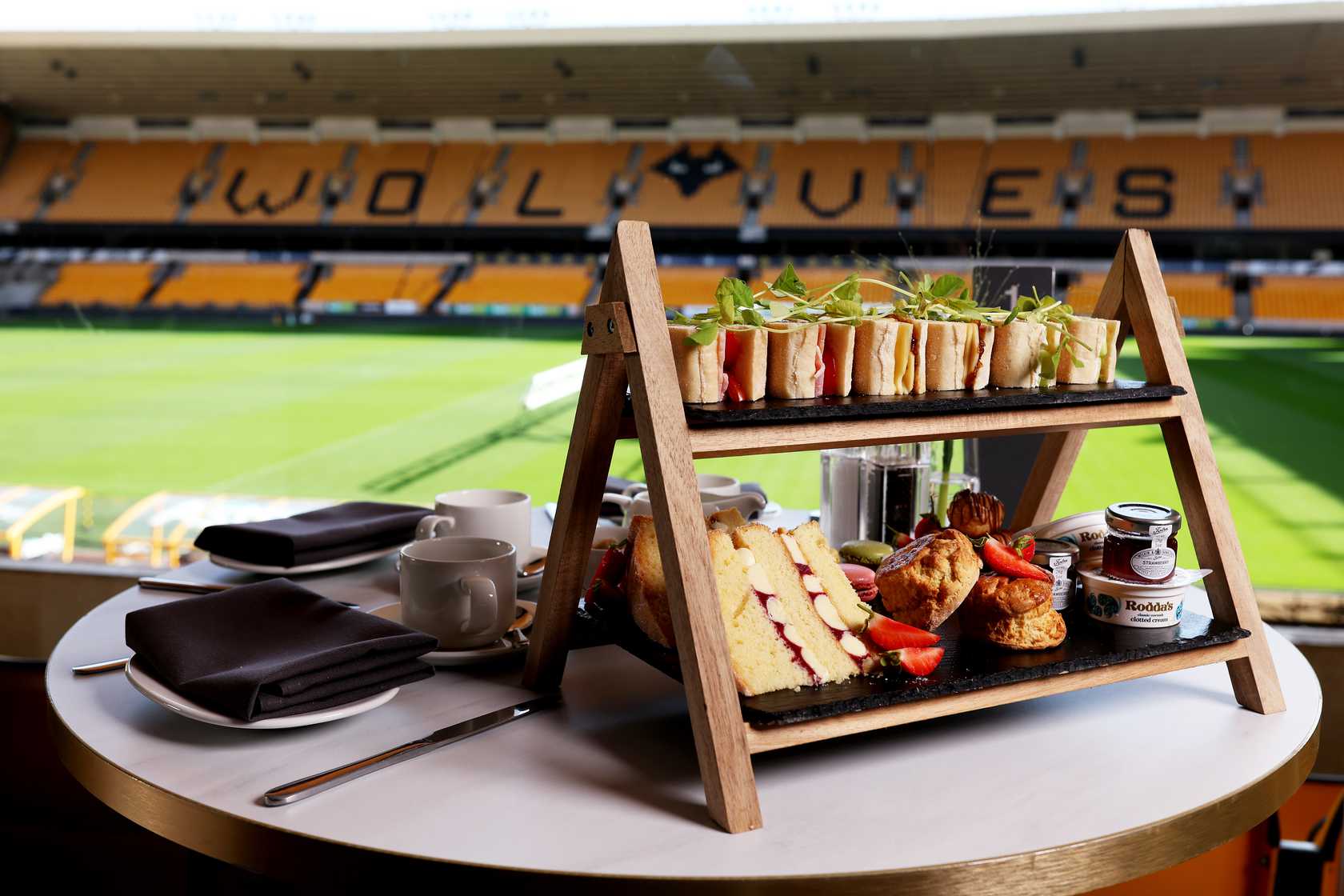 Afternoon tea food platter including sandwiches, cakes and scones for an afternoon tea and tour of Molineux Stadium